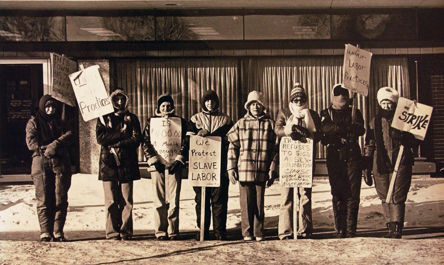 The Willmar Eight during their strike against the Citizens National Bank of Willmar. (L. to R.) Sandi Treml, Jane (Harguth) Groothuis , Sylvia (Erickson) Koll, Glennis (Andresen) Ter Wisscha, Doris Boshart, Teren Novotny, Shirley Solyntjes, and Irene Wallin.