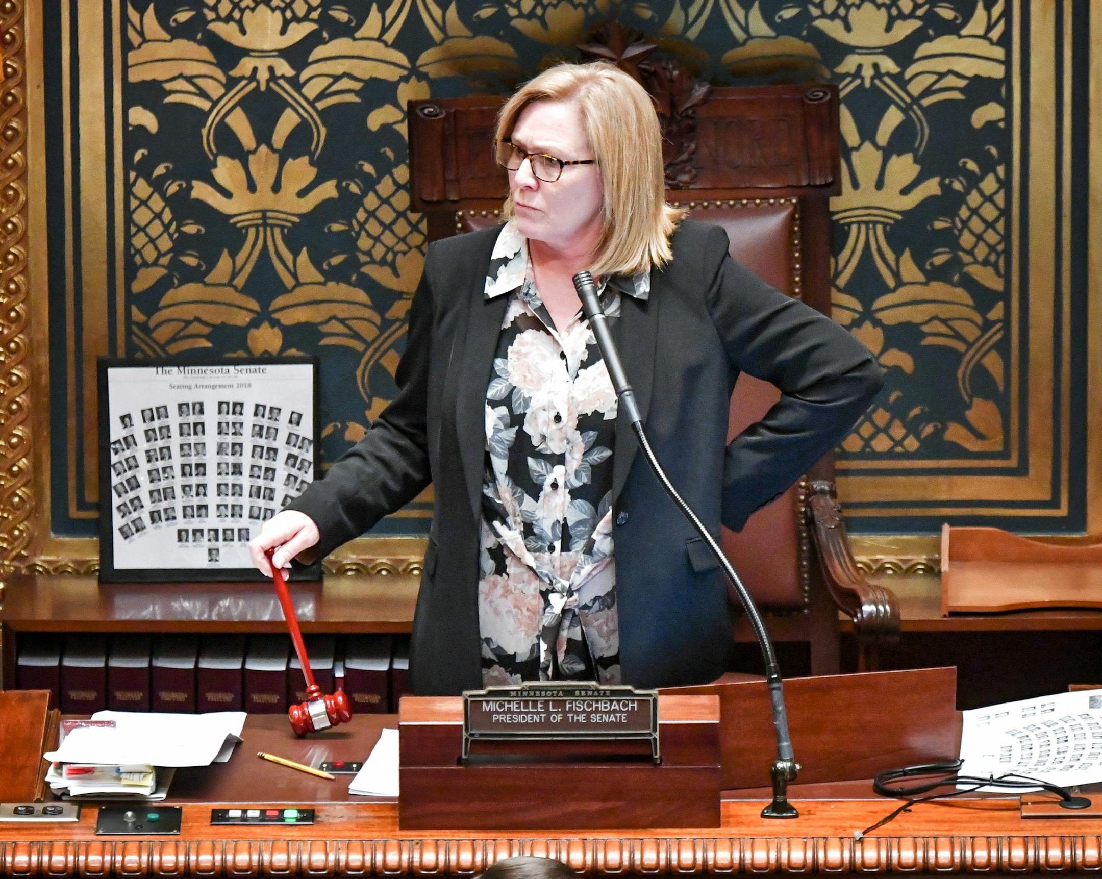 Three minutes after 12 noon call of the chair Lt. Gov. Michelle Fischbach waited for the DFL Senate members to come into the Senate Chamber. ] GLEN STUBBE • glen.stubbe@startribune.com Tuesday, February 20, 2018 The 2018 legislative session convenes in St. Paul with House and Senate convening at 12 noon. Biggest possible drama is in the Senate, where uncertainty around the status of Lt. Gov. Michelle Fischbach who is trying to simultaneously hold her Senate session.