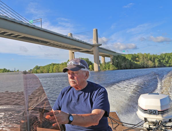 Bob Nasby of St. Paul navigated alongside the new St. Croix River bridge in search of smallmouth bass.