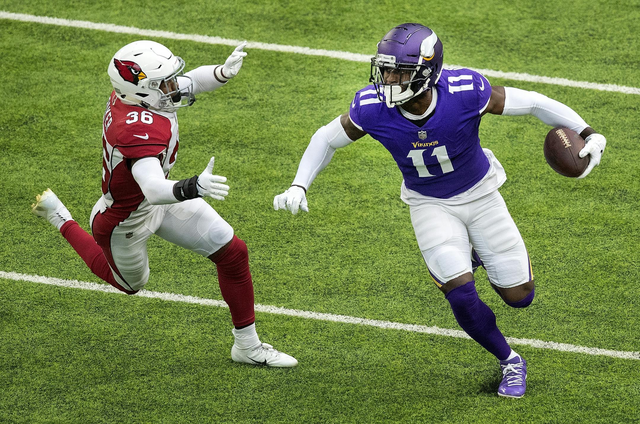 Laquon Treadwell (11) was chased by Budda Baker (36) in the first quarter.