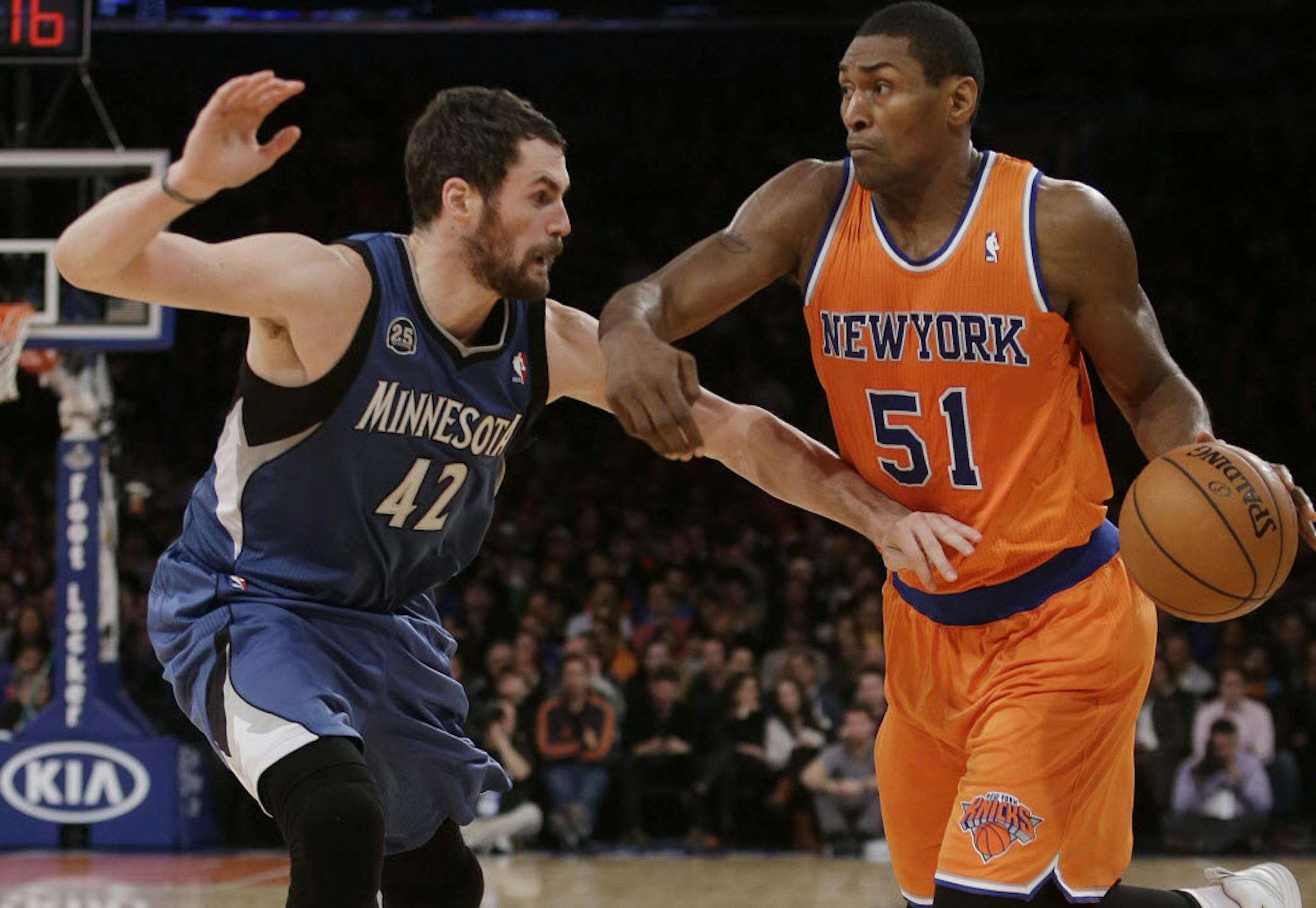 The Knicks' Metta World Peace tried to drive on Wolves forward Kevin Love.