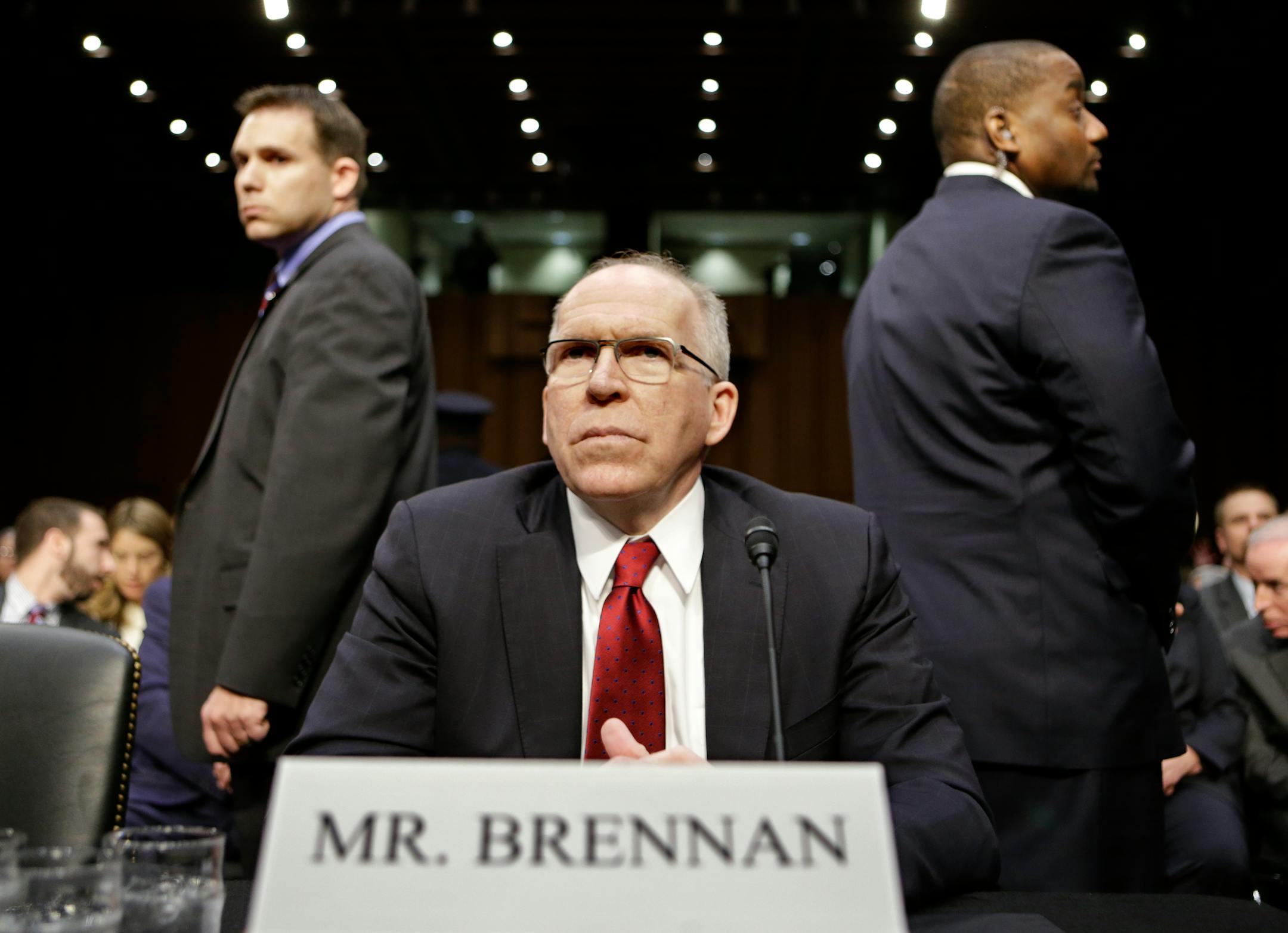 CIA Director nominee John Brennan, flanked by security, arrives on Capitol Hill in Washington, Thursday, Feb. 7, 2013, to testify at his confirmation hearing before the Senate Intelligence Committee.