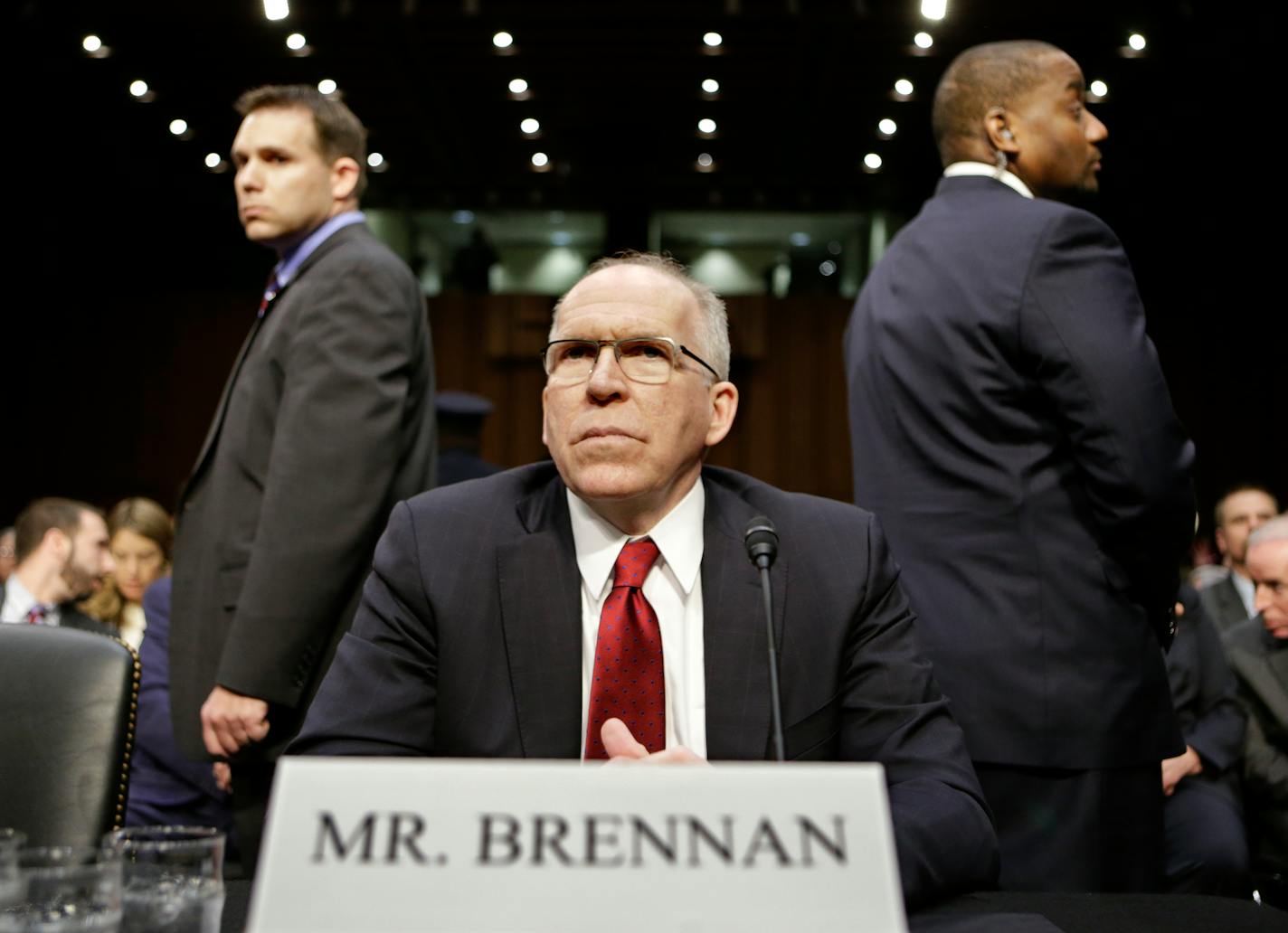 CIA Director nominee John Brennan, flanked by security, arrives on Capitol Hill in Washington, Thursday, Feb. 7, 2013, to testify at his confirmation hearing before the Senate Intelligence Committee.