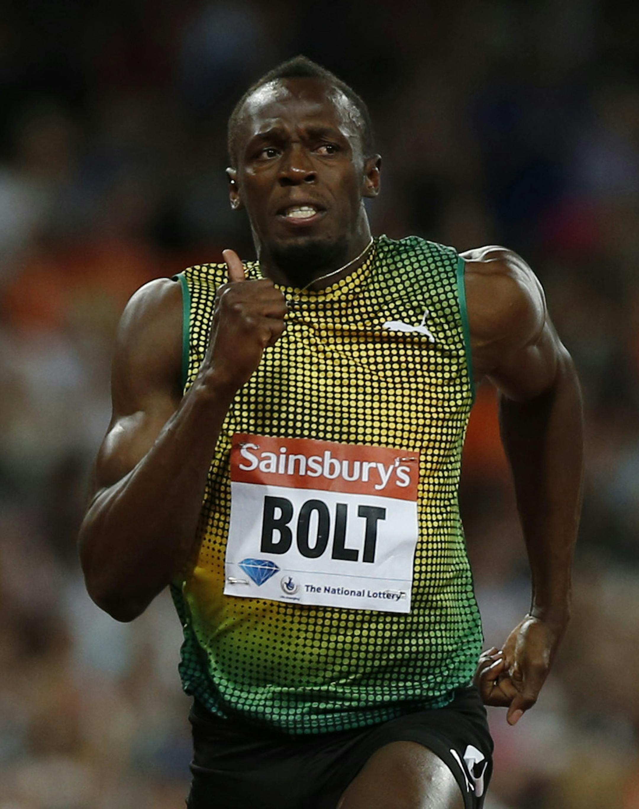 Usain Bolt of Jamaica races to win the men's 100m during the Diamond League athletics meet at The Stadium in Queen Elizabeth Olympic Park, London, Friday, July 26, 2013. The athletics meet marks the anniversary of the London 2012 Olympic Games. (AP Photo/Sang Tan)