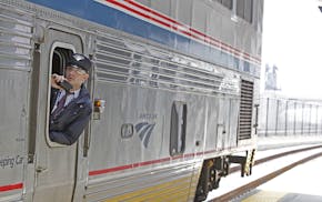 A conductor announced the departure of an Amtrak at the Union Depot, Thursday, May 8, 2014 in St. Paul, MN. It is the first passenger train in more th