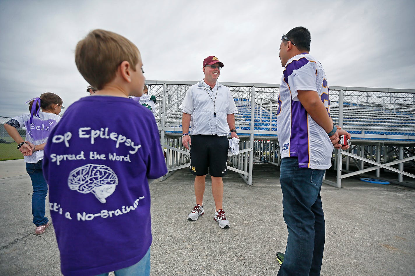 In this 2014 file photo, Gophers football coach Jerry Kill was greeted by epilepsy patients after practice at Freedom High School on Dec. 26, 2014, in Orlando, Fla.