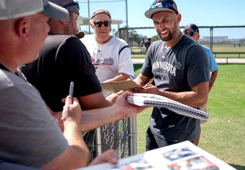 Minnesota Twins Royce Lewis autographed baseball cards  after practice.