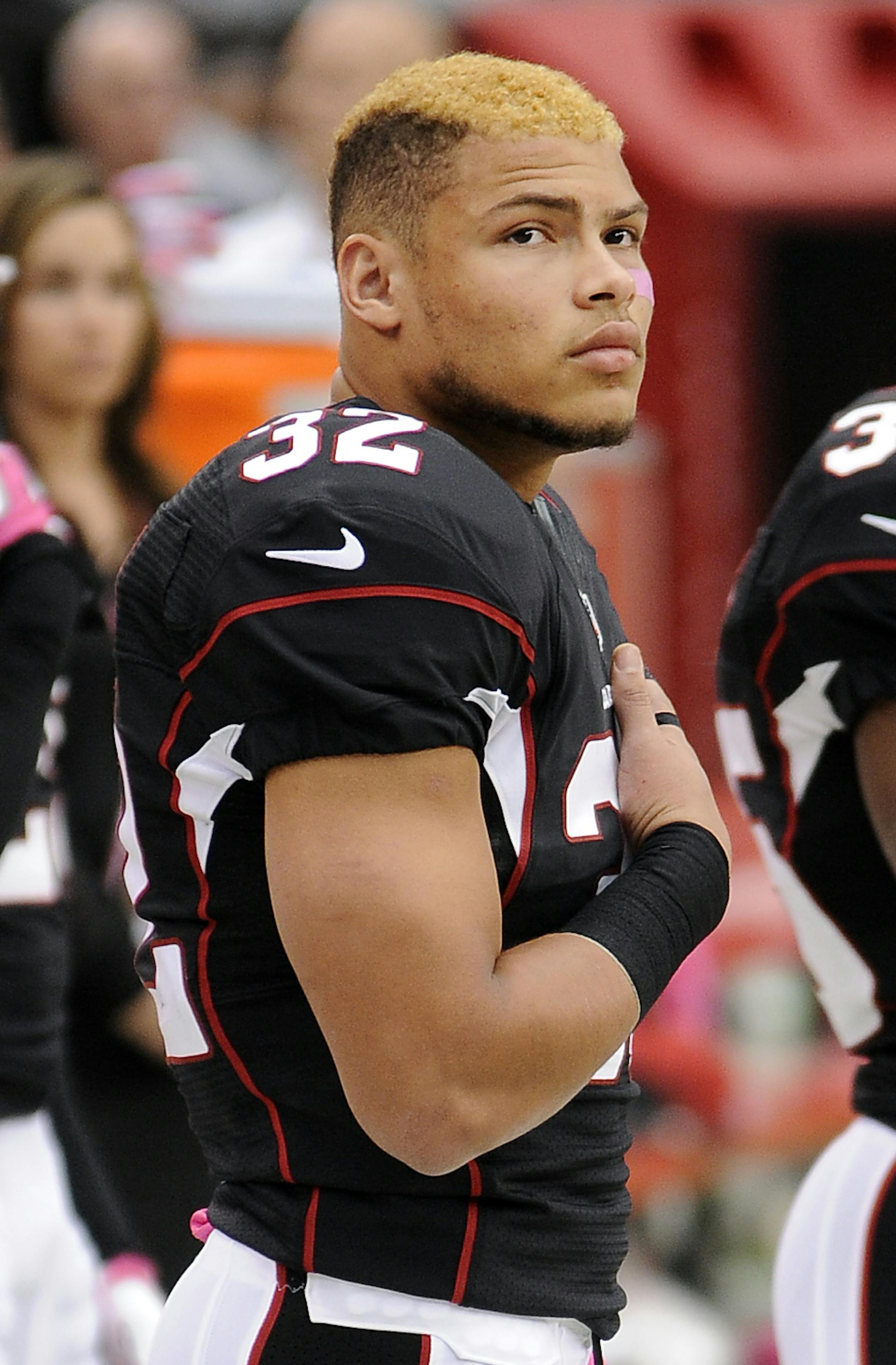 Arizona Cardinals safety (32) Tyrann Mathieu on the field during the national anthem before a game against the Carolina Panthers played at University of Phoenix Stadium in Glendale, Arizona, on Sunday, October 6, 2013. (AP Photo/John Cordes) ORG XMIT: MIN2013110215171139