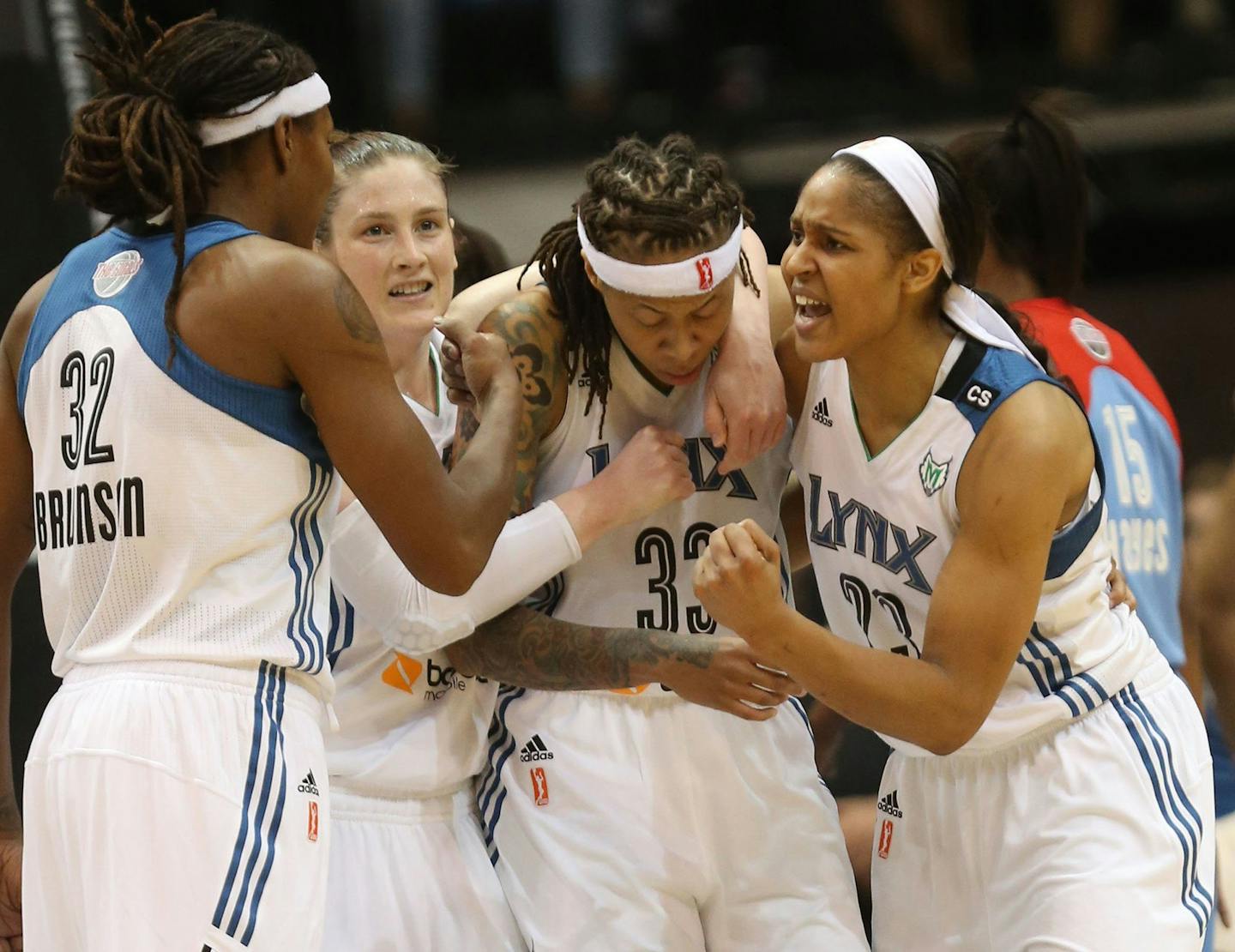 Seimone Augustus (33) of the Minnesota Lynx is surrounded by her teammates, from left, Rebekkah Brunson, Lindsay Whalen and Maya Moore after Augustus scored a basket and drew a foul in the fourth third quarter in Game 2 of the WNBA Finals at Target Center in Minneapolis, Minnesota, on Tuesday, October 8, 2013. The Lynx won, 88-63, for a 2-0 series lead. (Kyndell Harkness/Minneapolis Star Tribune/MCT) ORG XMIT: 1144187 ORG XMIT: MIN1310082240103371