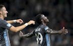 Minnesota United midfielder Jan Gregus (8), left, celebrated with forward Abu Danladi (99) after Danladi's goal against Orlando City during stoppage t