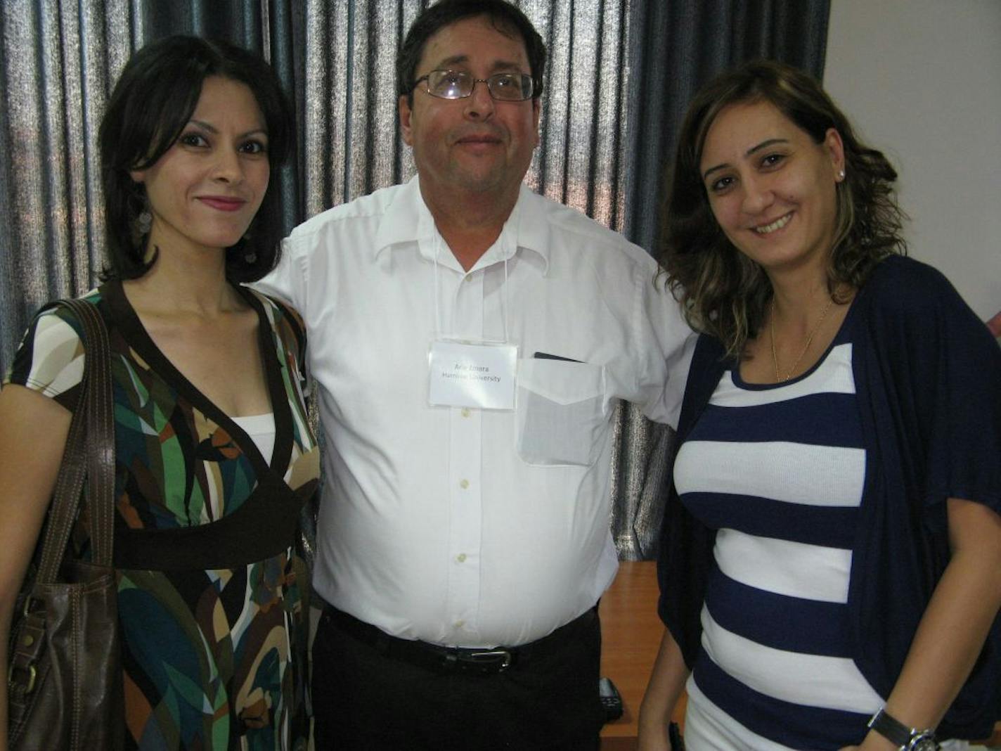 For ZMORA0910: (Image 4098) Pictured following a meeting in Ramallah, West Bank, are Hamline University Professor Arie Zmora (center), an Israeli native and Army combat veteran who has worked for years on citizen diplomacy through commerce and cultural ventures designed to transcend the Middle East's geographic and religious borders, and Palestinian entrepreneurs and Hamline Middle East Fellows Reem Saleh (left) and Mayada Diab (right). Ramallah has been dubbed the "Silicon Valley" of Palestinia