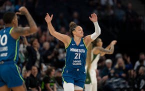 Lynx guard Kayla McBride (21) celebrates scoring in the first half against the Seattle Storm at Target Center on Tuesday.