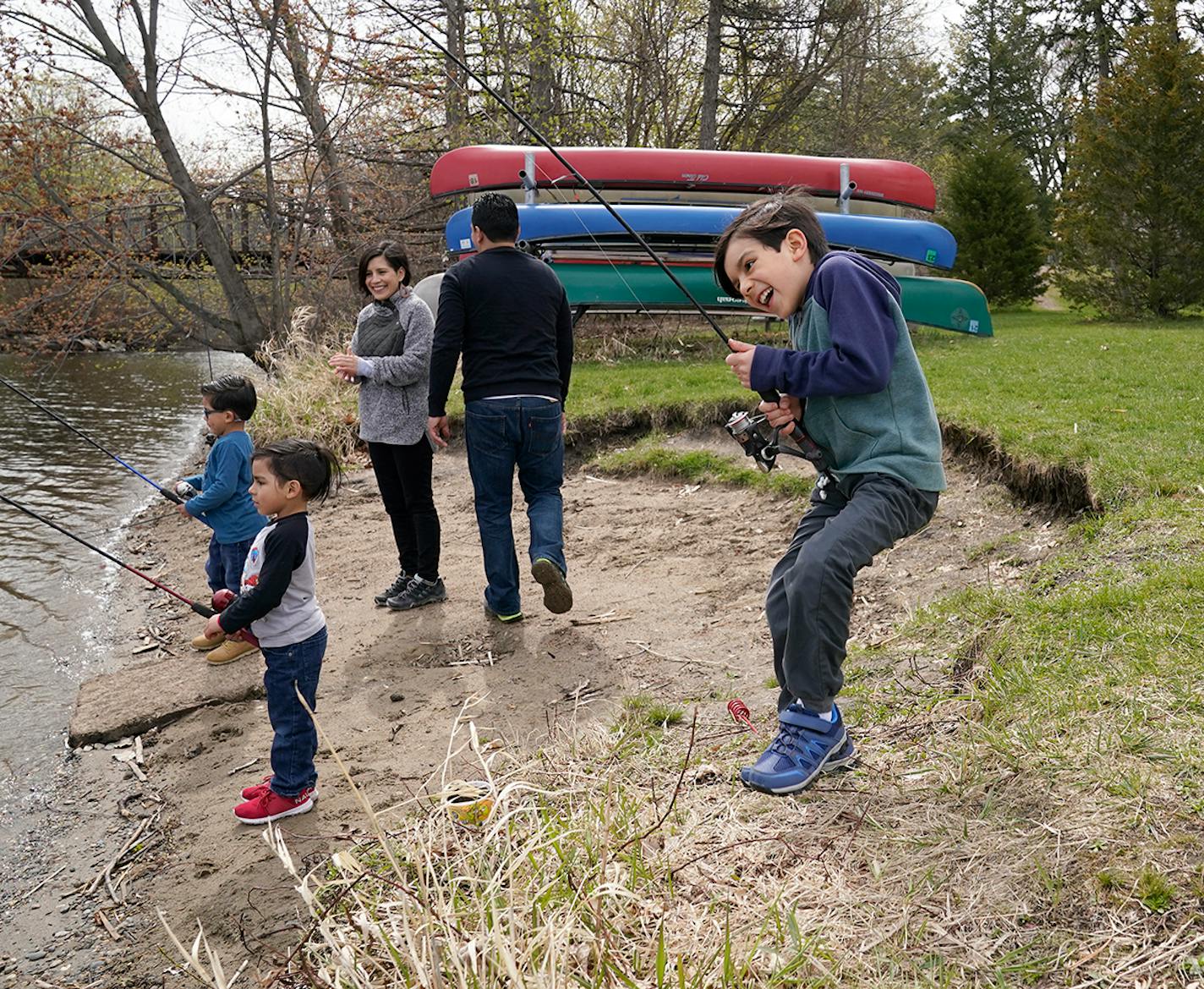 Jared Cuevas, middle right, and his wife, Elsa Sanchez, middle left, fished with twin sons Aaron and Eric, both 5, and Ian, 8, right.