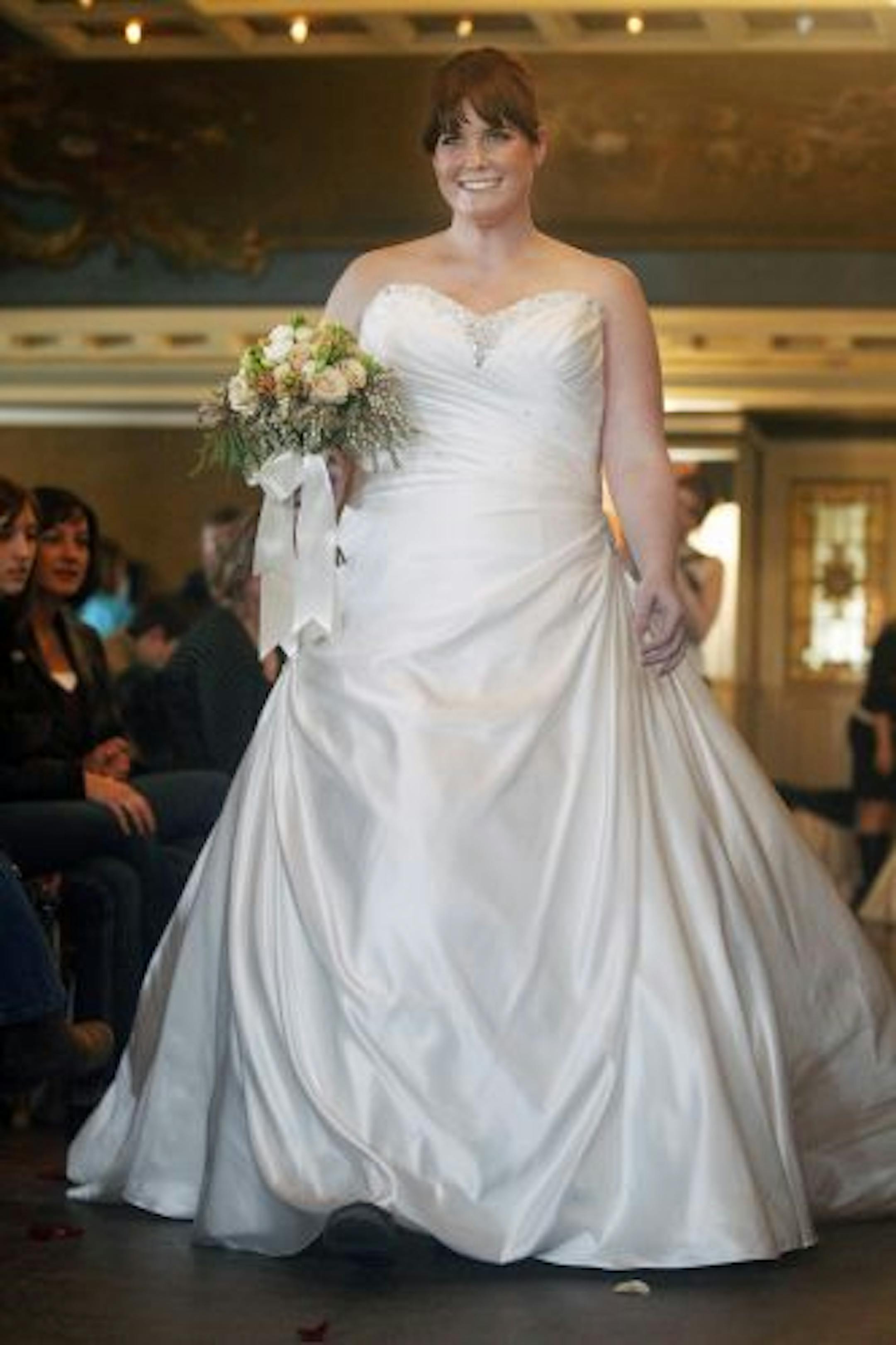 At the Semple Mansion, Sara Bartlett models a dress by Essence of Australia.