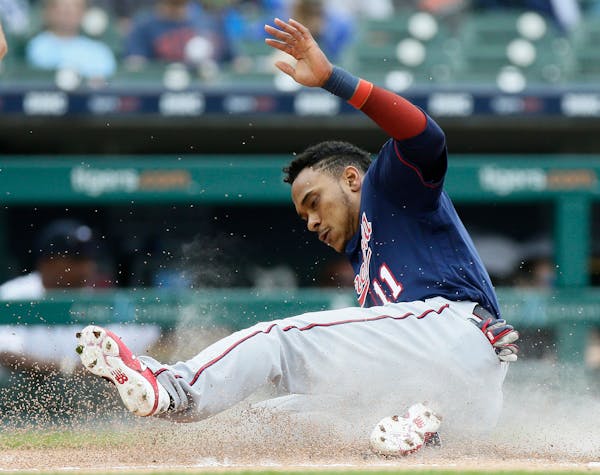 Jorge Polanco (11) of the Minnesota Twins scores against the Detroit Tigers on a double by Mitch Garver during the first inning on Sunday, June 9, 201