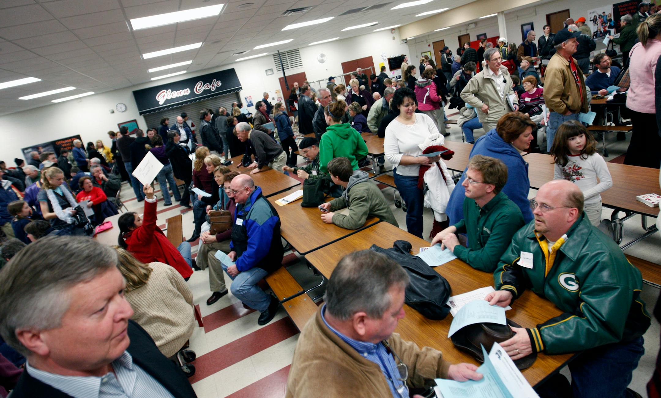 At John Glenn Middle school, Maplewood, a record crowd dispersed to various rooms to caucus.