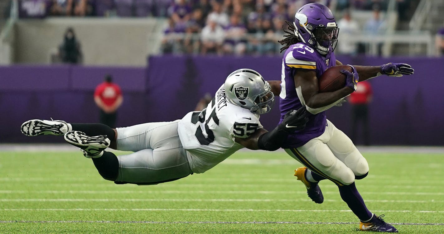 Minnesota Vikings running back Dalvin Cook (33) was brought down by Oakland Raiders outside linebacker Vontaze Burfict (55) as he ran the ball in the second quarter. ] ANTHONY SOUFFLE &#x2022; anthony.souffle@startribune.com The Minnesota Vikings played the Oakland Raiders in an NFL game Sunday, Sept. 22, 2019 at U.S. Bank Stadium in Minneapolis.