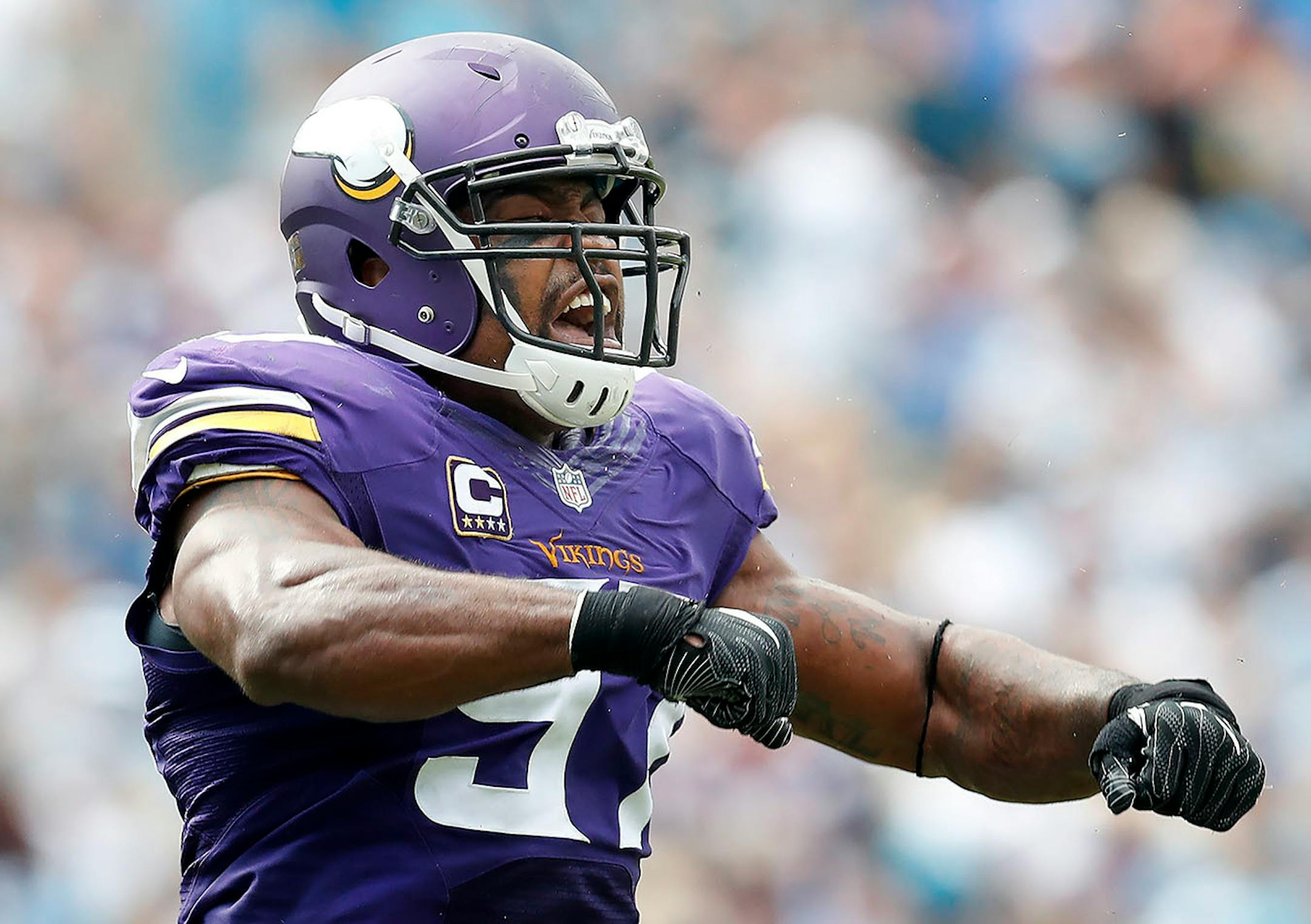 Everson Griffen (97) celebrated after sacking Cam Newton (1) in the fourth quarter.