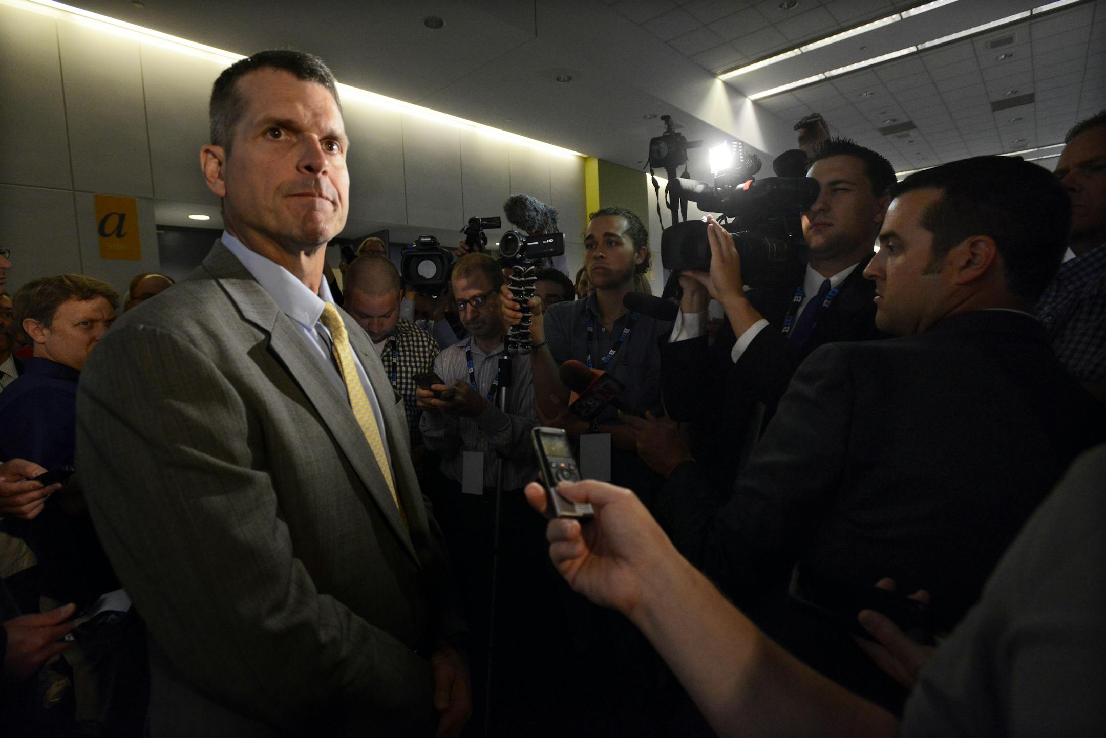 Michigan head coach Jim Harbaugh speaks to the media during the NCAA college Big Ten Football Media Day Friday, July 31, 2015 in Chicago. (AP Photo/Paul Beaty)