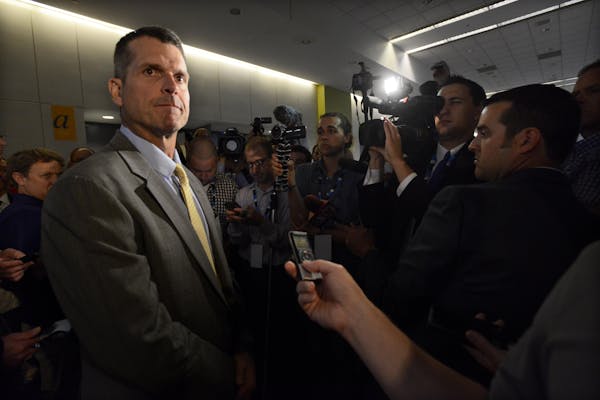 Michigan head coach Jim Harbaugh speaks to the media during the NCAA college Big Ten Football Media Day Friday, July 31, 2015 in Chicago. (AP Photo/Pa