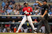 Minnesota Twins second baseman Nick Gordon reacted after he struck out looking to end the first inning .