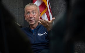 Mayor Dave Kleis speaks with a group of attendees during a 24-hour town hall inside City Hall in St. Cloud, Minn., in February.