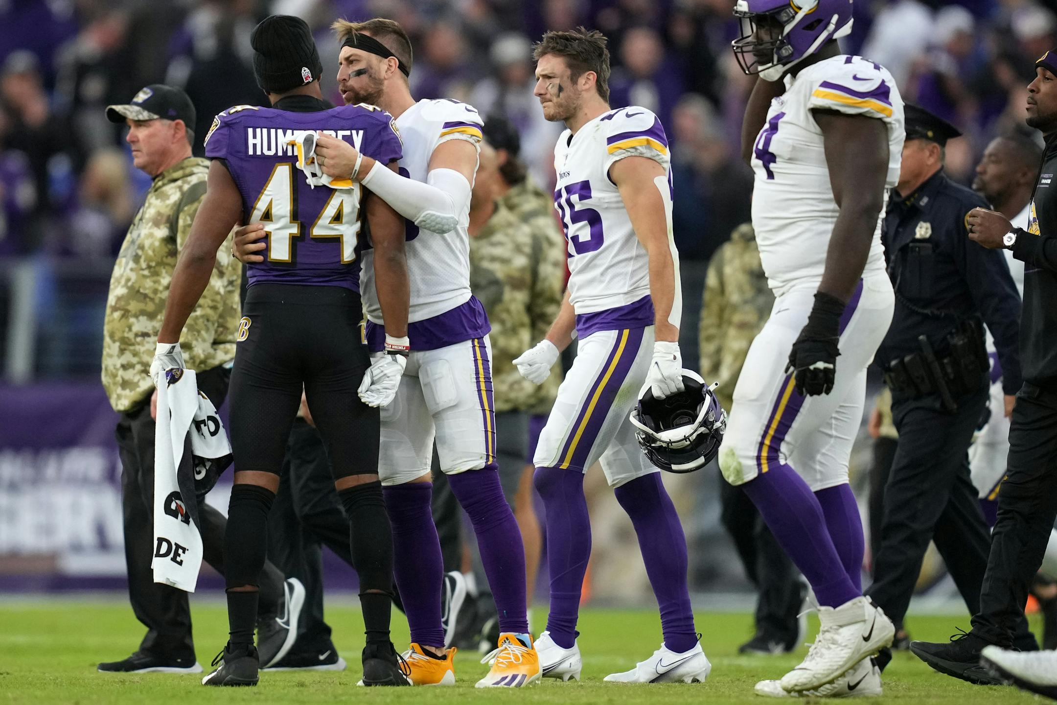Vikings wide receiver Adam Thielen (19) greeted Ravens cornerback Marlon Humphrey (44) after losing in overtime.