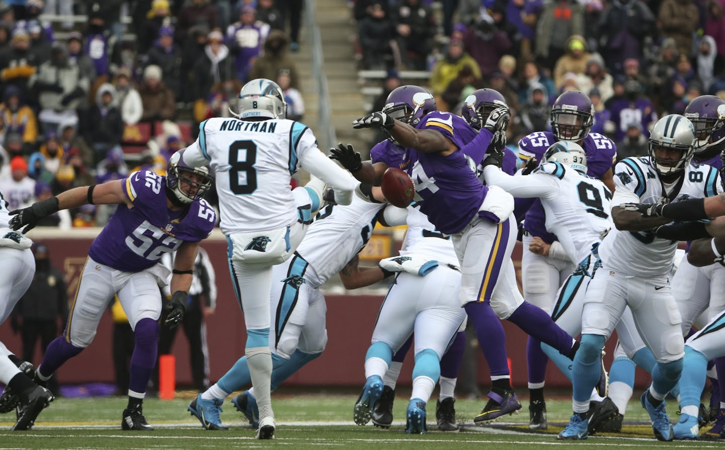 Vikings middle linebacker Jasper Brinkley (54) blocked a second quarter punt by Panthers punter Brad Nortman (8). Teammate Minnesota Vikings defensive end Everson Griffen recovered the ball and ran 43 yards for the Vikings second blocked kick touchdown of the game Sunday afternoon.