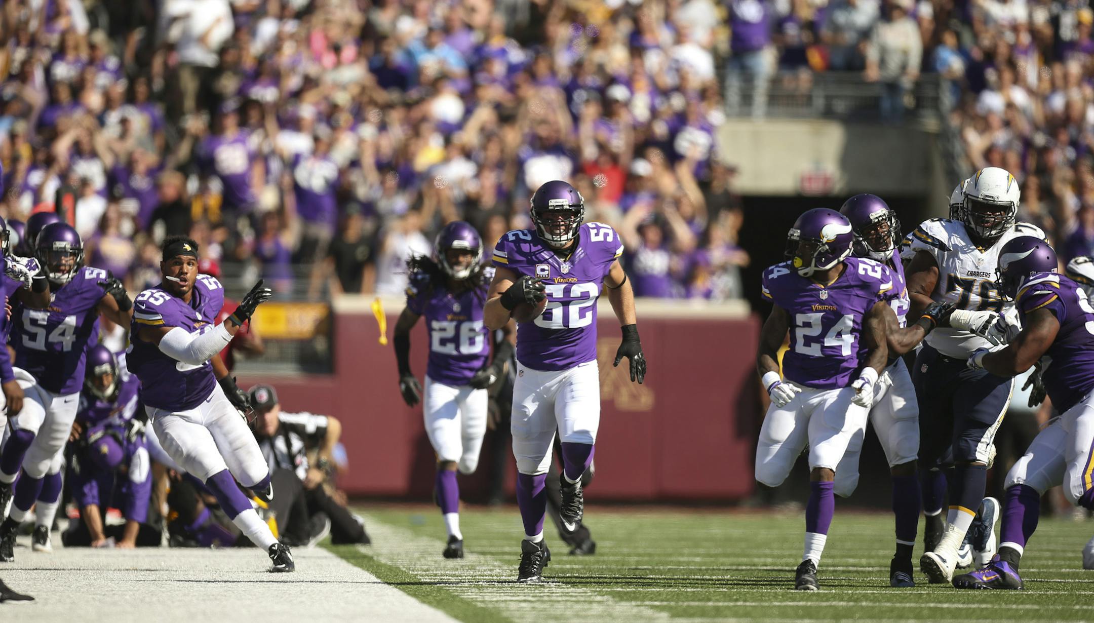 Vikings outside linebacker Chad Greenway (52) intercepted a fourth quarter pass and ran it back 91 yards for a touchdown Sunday afternoon. He was accompanied by Vikings cornerback Captain Munnerlyn (24) as he approached the end zone. ] JEFF WHEELER &#xef; jeff.wheeler@startribune.com The Minnesota Vikings beat the San Diego Chargers 31-14 in an NFL football game Sunday afternoon, September 27, 2015 at TCF Bank Stadium in Minneapolis.