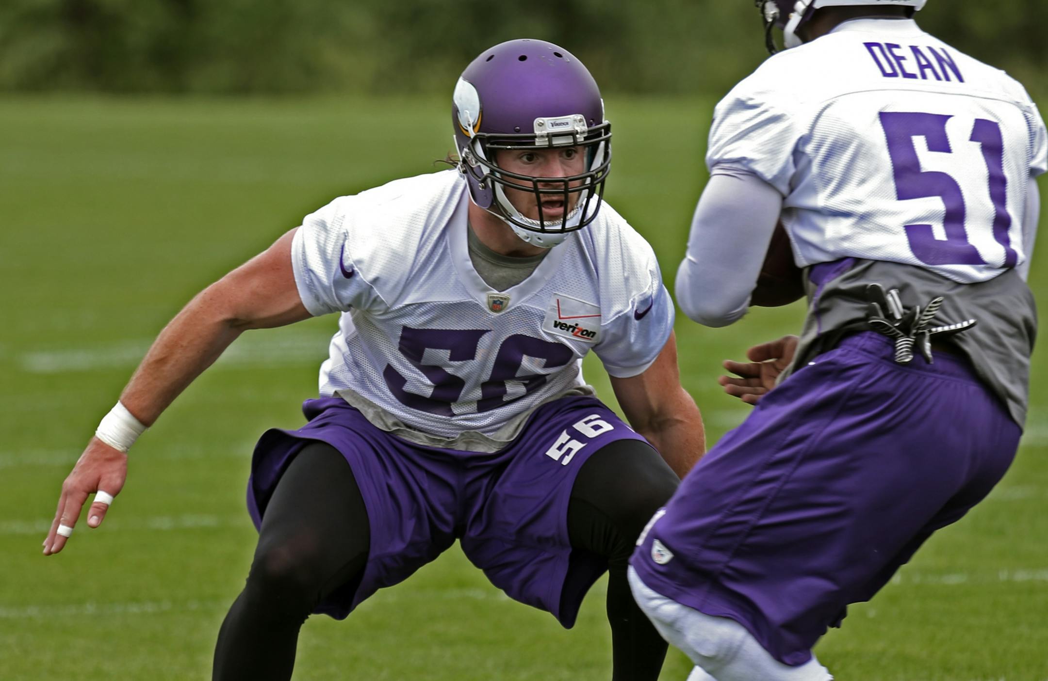 (left to right) Michael Mauti closed in on Larry Dean during mini-camp practice at Winter Park on 6/18/14.