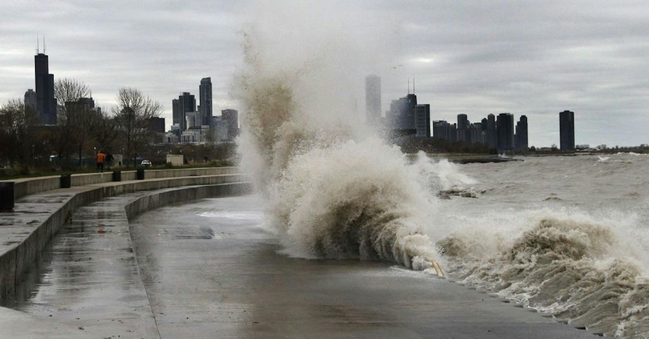 Strong waves crash against the Lake Michigan waterfront at the 31st Street Beach on the south side of Chicago on Tuesday, Oct. 30, 2012. Strong winds from the outer edge of superstorm Sandy are creating near-record high waves on Lake Michigan.