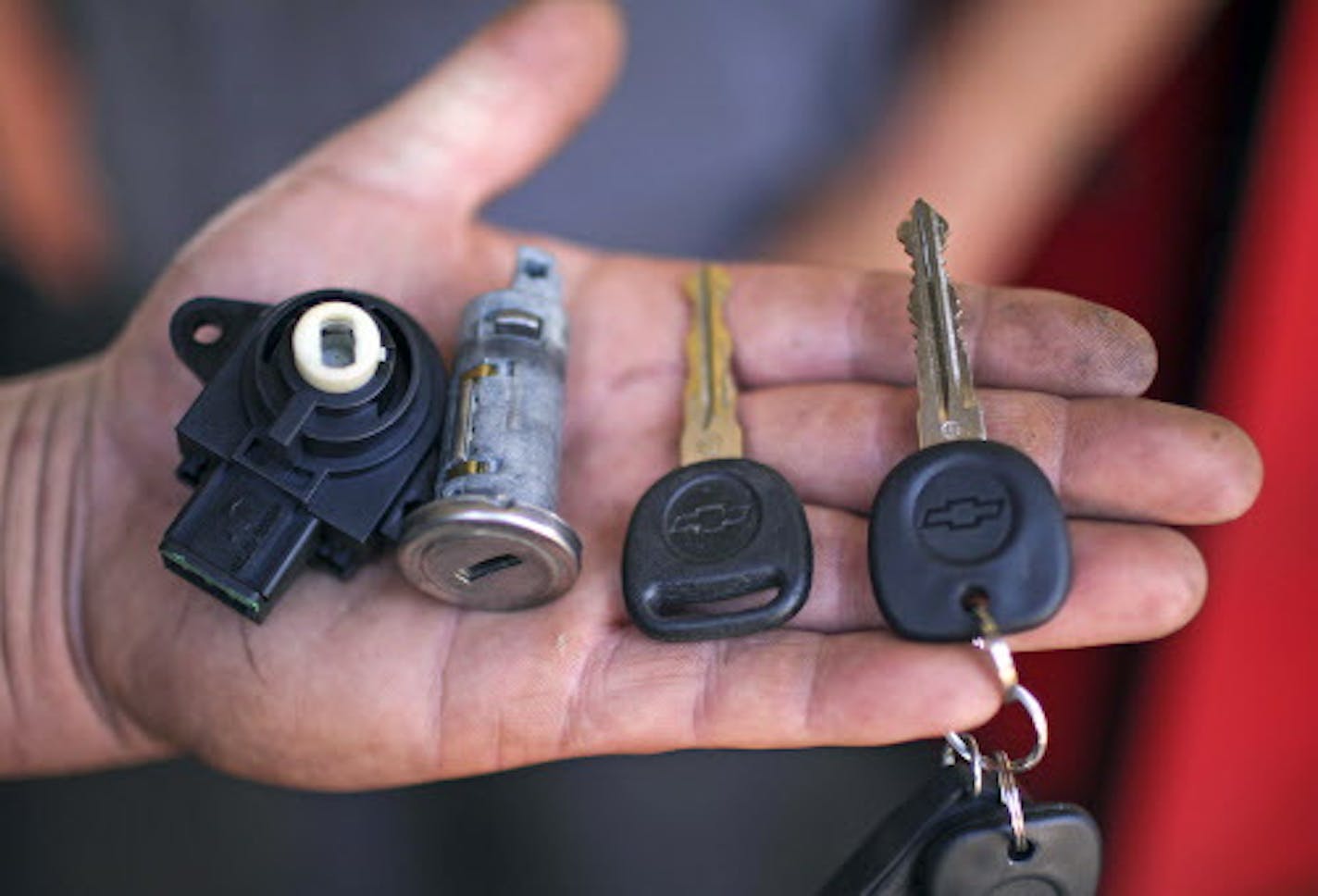 Tom Wenzel, a service technician at the White Bear Lake Superstore, held a start switch, ignition lock cylinder, key, together with a new replacement key start switch for a vehicle that needed it replaced as part of the current recall on a GM vehicle at the dealership in White Bear Lake Wednesday afternoon. ] JEFF WHEELER &#xef; jeff.wheeler@startribune.com Despite a massive recall of their vehicles, GM dealers have seen an uptick in business. We look at the White Bear Lake Superstore in White B