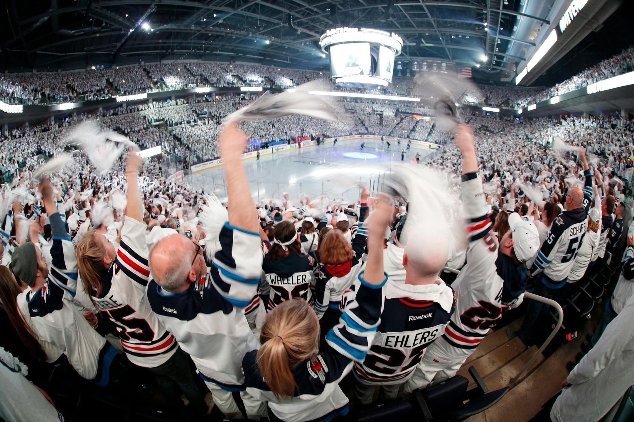 Winnipeg Jets fans cheer on the team as players hit the ice before Game 1 in an NHL hockey first-round playoff series against the Minnesota Wild, Wednesday, April 11, 2018, in Winnipeg, Manitoba.