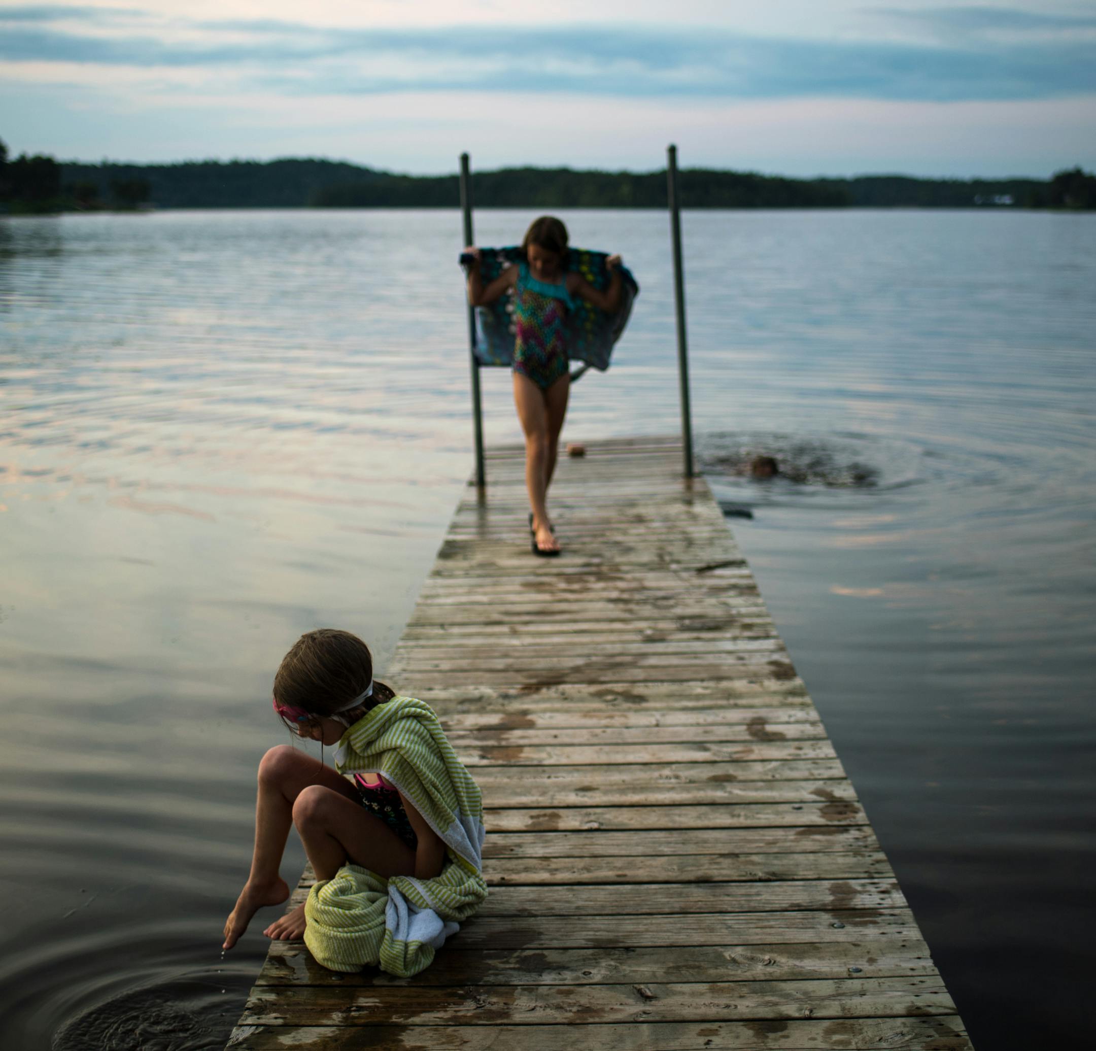 Haley Cosert, 6, of Brainerd, dipped her toes into the water as her sister, Emelia, 9, dried off after swimming in Rice Lake, a small lake formed on the edge of the Mississippi River in Brainerd, in mid August. ] (AARON LAVINSKY/STAR TRIBUNE) aaron.lavinsky@startribune.com RIVERS PROJECT: We look at three of Minnesota's rivers, including the Mississippi, Red and Chippewa, to see how land use effects water quality and pollution.