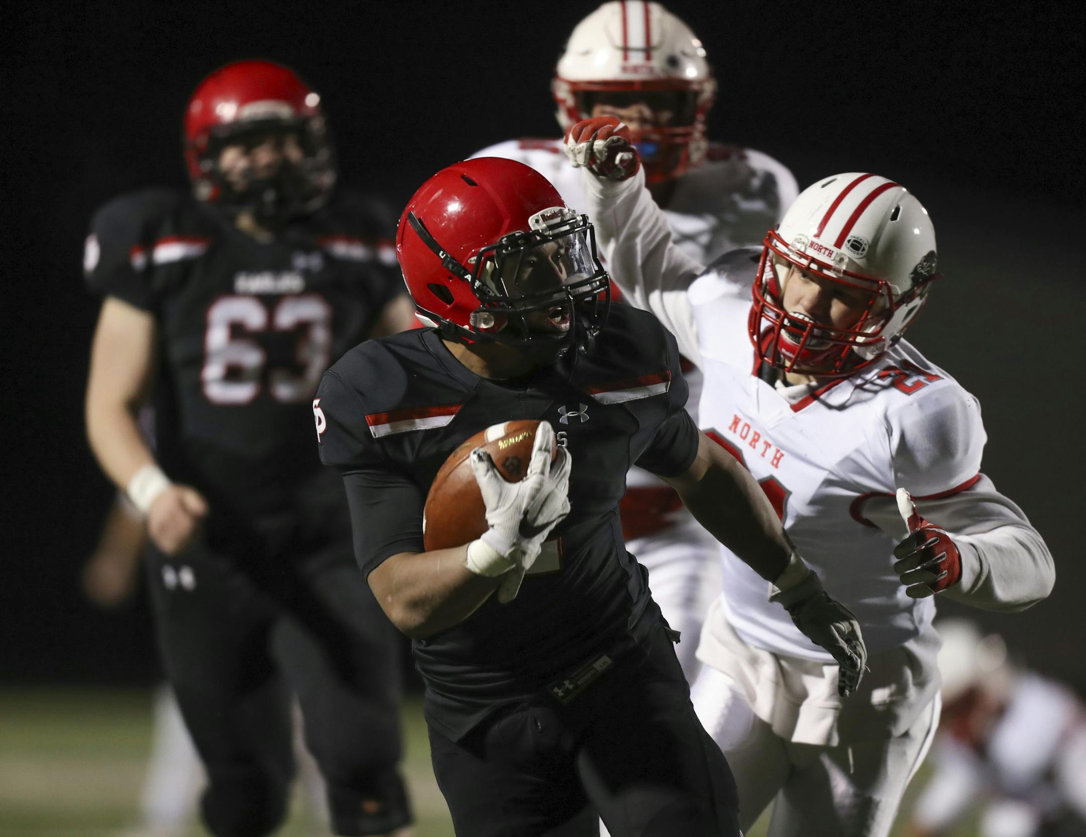 Eden Prairie's Solo Falaniko with a second quarter carry for a first down. ] JEFF WHEELER ï jeff.wheeler@startribune.com Eden Prairie and Lakeville North met in the Class 6A state tournament quarterfinal game on a chilly Thursday night at Chanhassen High School.
