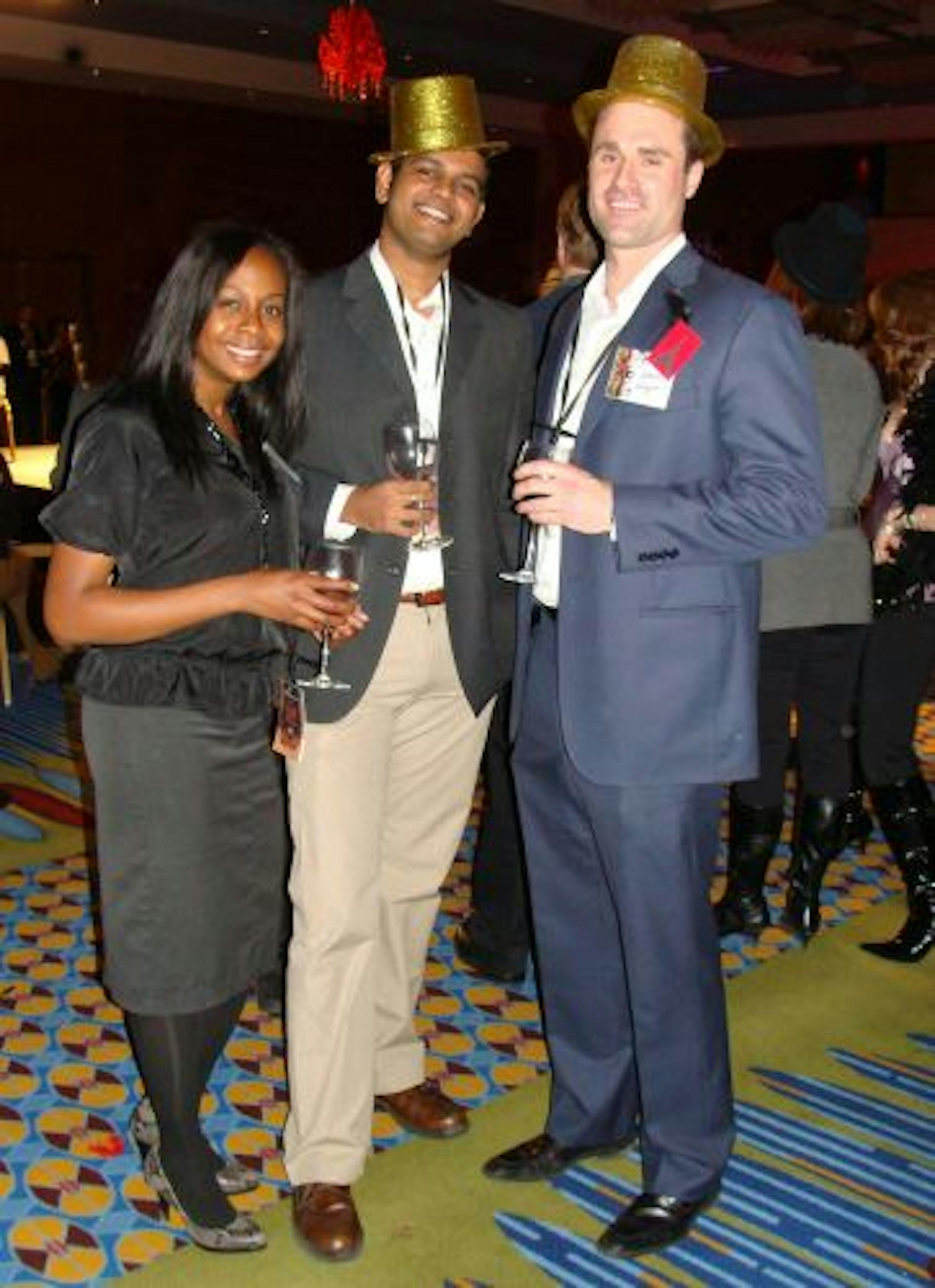 Sara Glassman, sglassman@startribune.com The United Way's Emerging Leaders wine tasting at the Marriott City Center had a French cabaret theme. Erica Buchanan, Vijay Subramanian and John Nigon