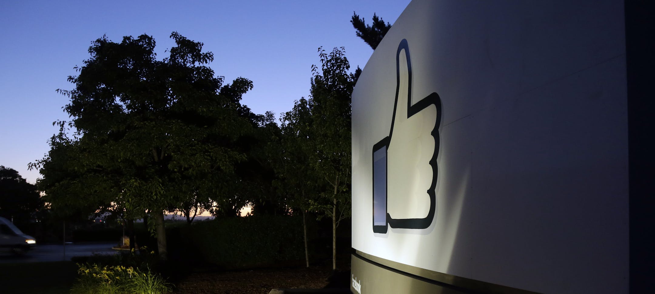 The Facebook "like" symbol is illuminated on a sign outside the company's headquarters in Menlo Park, Calif., Friday, June 7, 2013. A leaked document has laid bare the monumental scope of the government's surveillance of Americans' phone records ó hundreds of millions of calls ó in the first hard evidence of a massive data collection program aimed at combating terrorism under powers granted by Congress after the 9/11 attacks. The companies include Microsoft, Yahoo, Google, Facebook, Pa