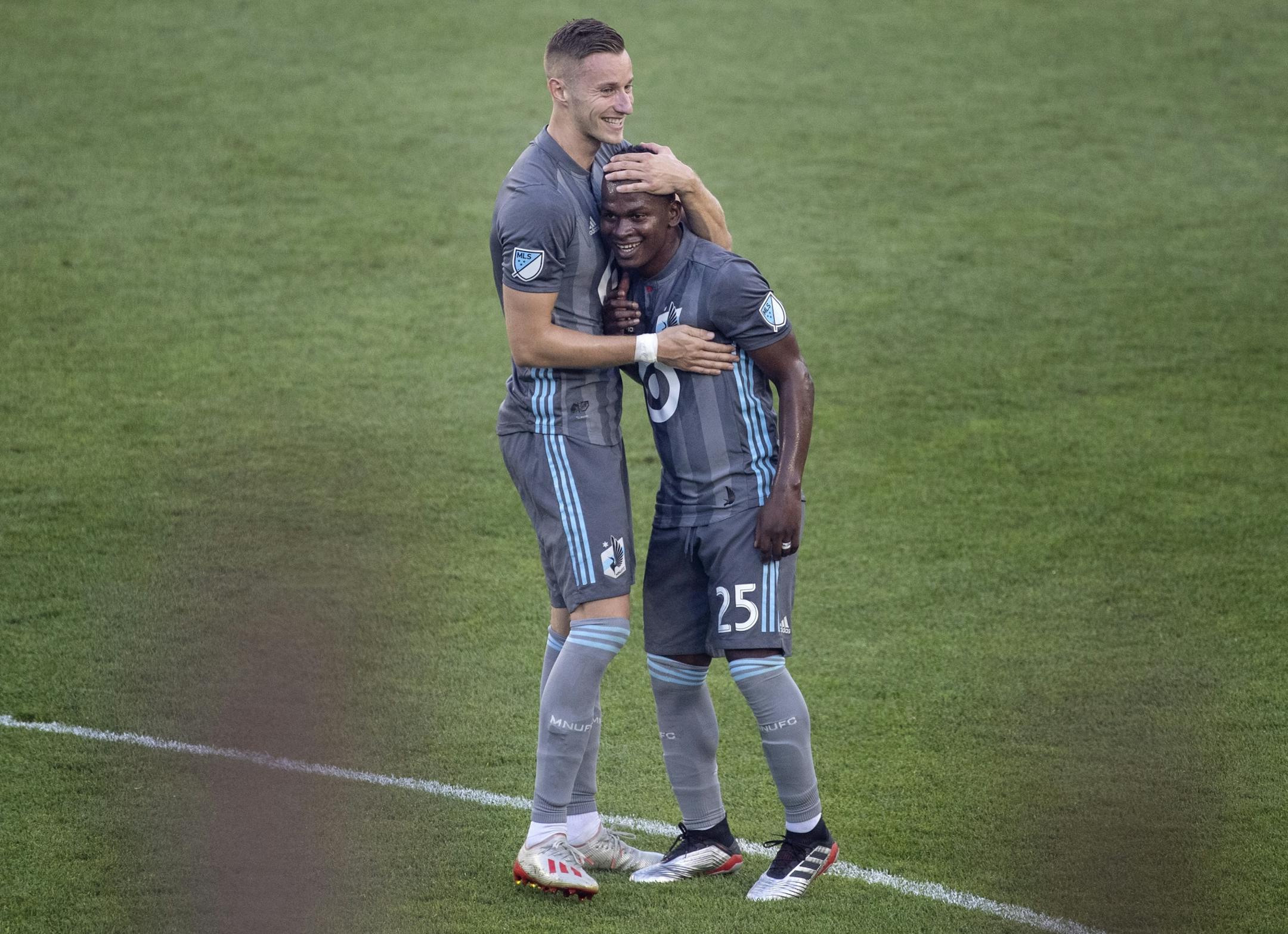 Jan Gregus (8) celebrated with Darwin Quintero (25) after scoring a goal in the first half.