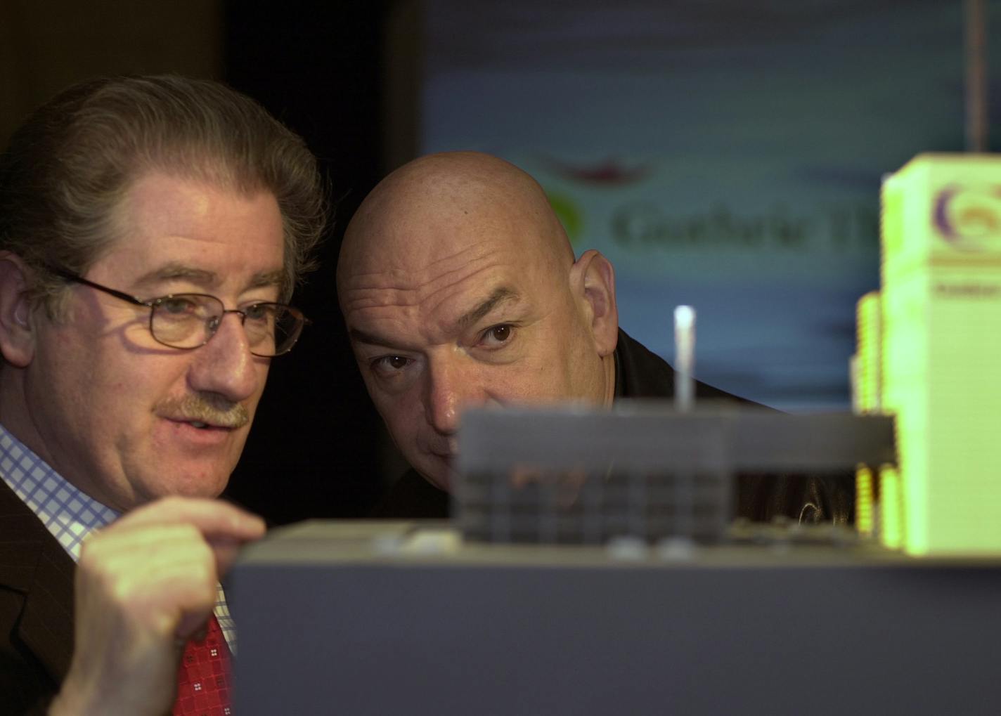 GENERAL INFORMATION: French architect Jean Nouvel IN THIS PHOTO: Minneapolis, MN;2/7/2002:Left to right---Guthrie artistic director/CEO Joe Dowling and French architect Jean Nouvel check out a model of Nouvel's design of the new Guthrie being shown to Guthrie staffers at a reception at the Milwaukee Depot.