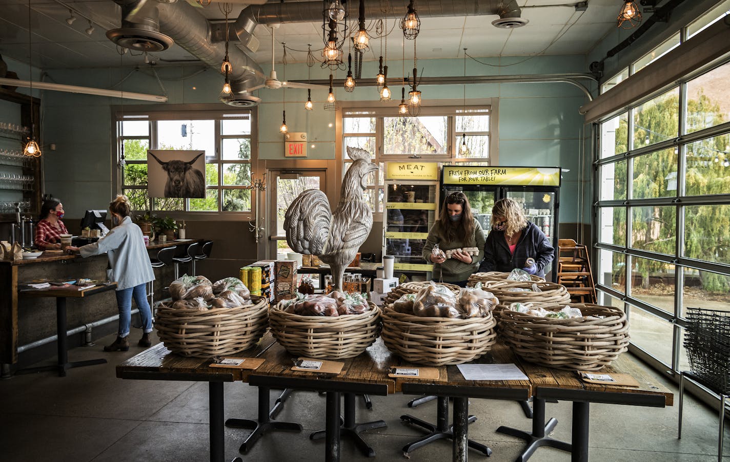 Jackie Slinger and her daughter, Sammy, shopped at Wise Acre Eatery, which is selling fresh food from its Plato, Minn., farm.