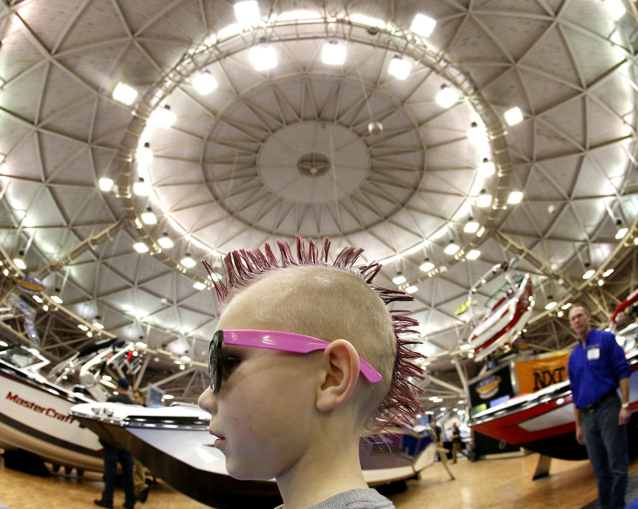 Kaeden Maxa, 7, of Shakopee, took in the sights with his family at the Minneapolis Boat Show at the Minneapolis Convention Center on Sunday. ] CARLOS GONZALEZ cgonzalez@startribune.com, January 25, 2015, Minneapolis, Minn., standalone photo from the Minneapolis Boat Show, Minneapolis Convention Center.
