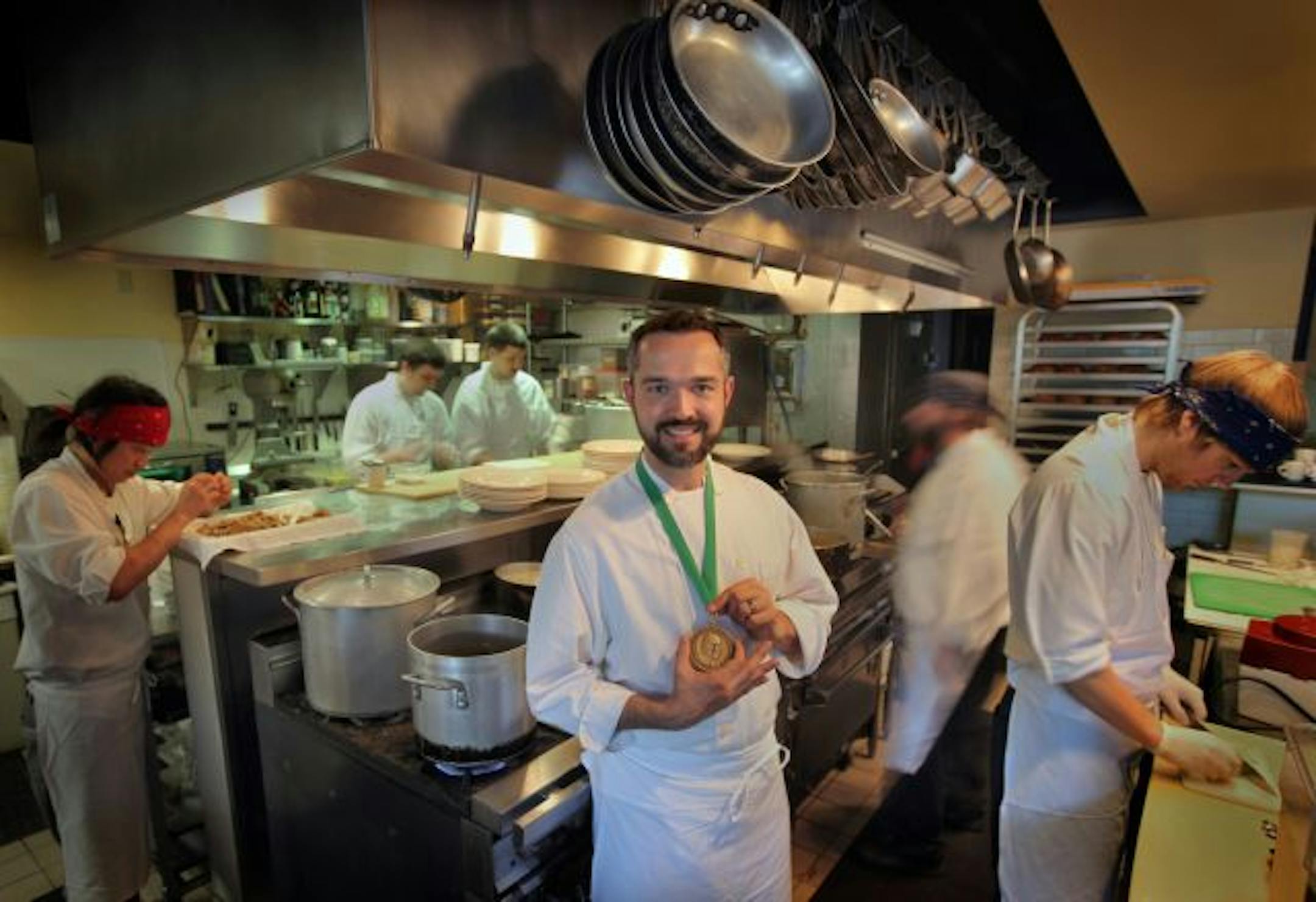 Alex Roberts of Restaurant Alma with the James Beard Medal he recently received for Best Chef: Midwest.
