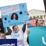 Erin Longbottom, left, holds up a sign in support of birth control access during a rally outside the Supreme Court in Washington, Wednesday, March 23, 2016, as the court hears arguments to allow birth control in healthcare plans in the Zubik vs. Burwell case. The Supreme Court seems deeply divided over the arrangement devised by the Obama administration to spare faith-based groups from having to pay for birth control for women covered under their health plans. (AP Photo/Jacquelyn Martin)