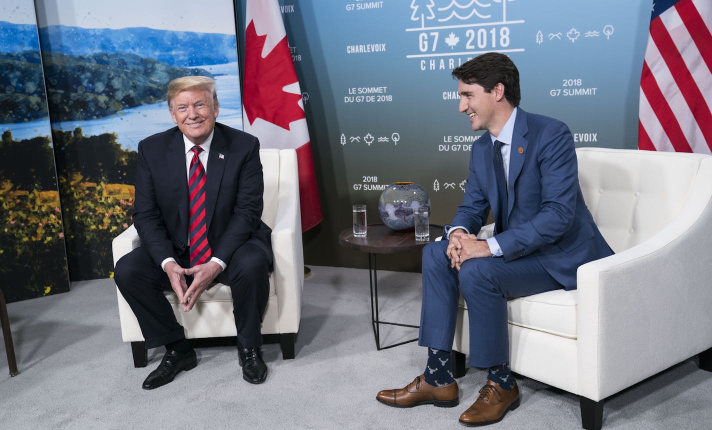 President Donald Trump makes a joke about leaving the summit early during a bilateral meeting with Canadian Prime Minister Justin Trudeau at the G-7 summit meeting in La Malbaie, Quebec, Canada, June 8, 2018. Earlier Friday, Trump called on the world&#xed;s leading economies to reinstate Russia to the Group of 7 nations four years after it was cast out for annexing Crimea, once again putting him at odds with America&#xed;s leading allies in Europe and Asia. (Doug Mills/The New York Times)