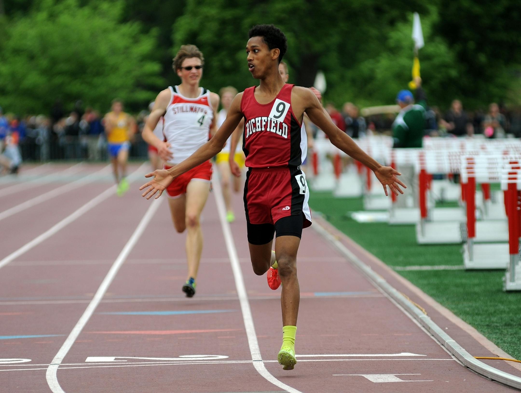 Obsa Ali of Richfield Number 9 crossed the finish line of the Boy's 2A3200 meters in record time at the State 2A track Meet at Hamline University Stadium in St Paul, Minn. Friday June 7, 2013