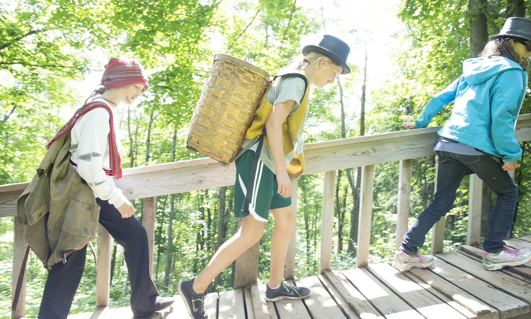 "Voyageurs" portage back from an expedition to Wolf Lake.