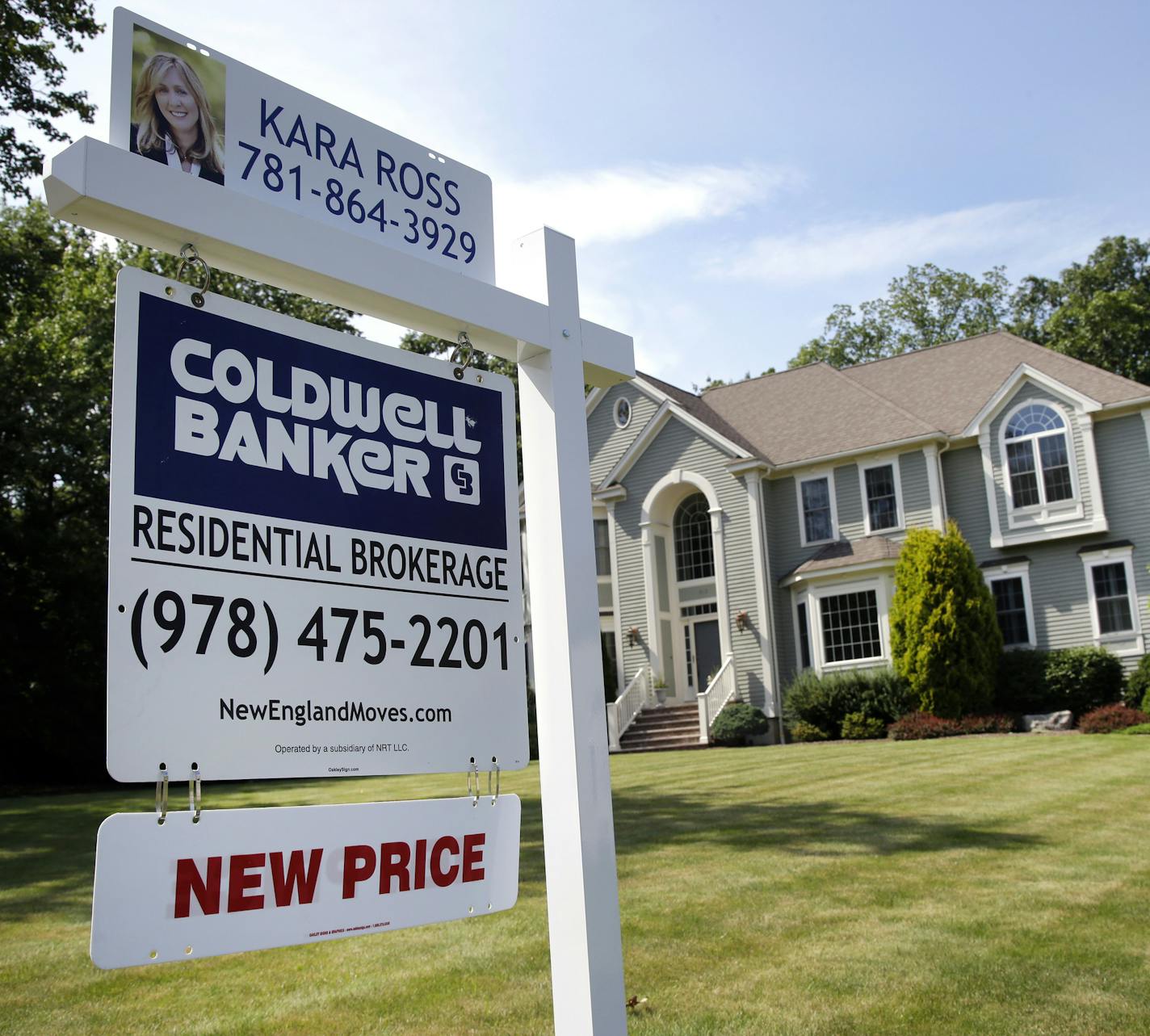 This Monday, July 10, 2017, photo shows a home for sale, in North Andover, Mass. On Monday, July 24, 2017, the National Association of Realtors reports on sales of existing homes in June. (AP Photo/Elise Amendola)