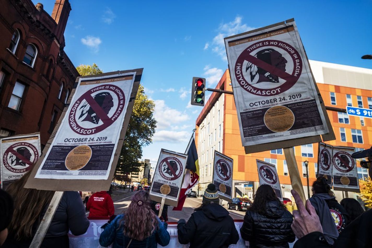 Protesters marched from Peavey Park to U.S. Bank Stadium on Thursday to protest the use of the nickname used by the NFL team in Washington, which is playing the Vikings.