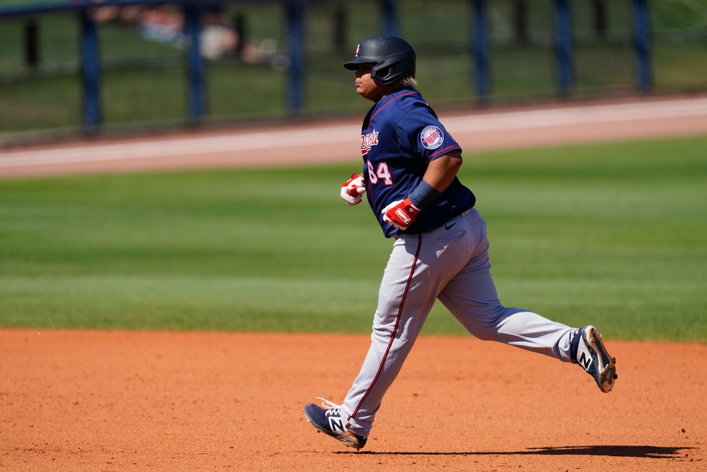 Minnesota Twins catcher Willians Astudillo rounds the bases after hitting a solo home run in the eighth inning of a spring training baseball game against the Tampa Bay Rays Saturday, March 13, 2021, in Port Charlotte, Fla.. (AP Photo/John Bazemore)