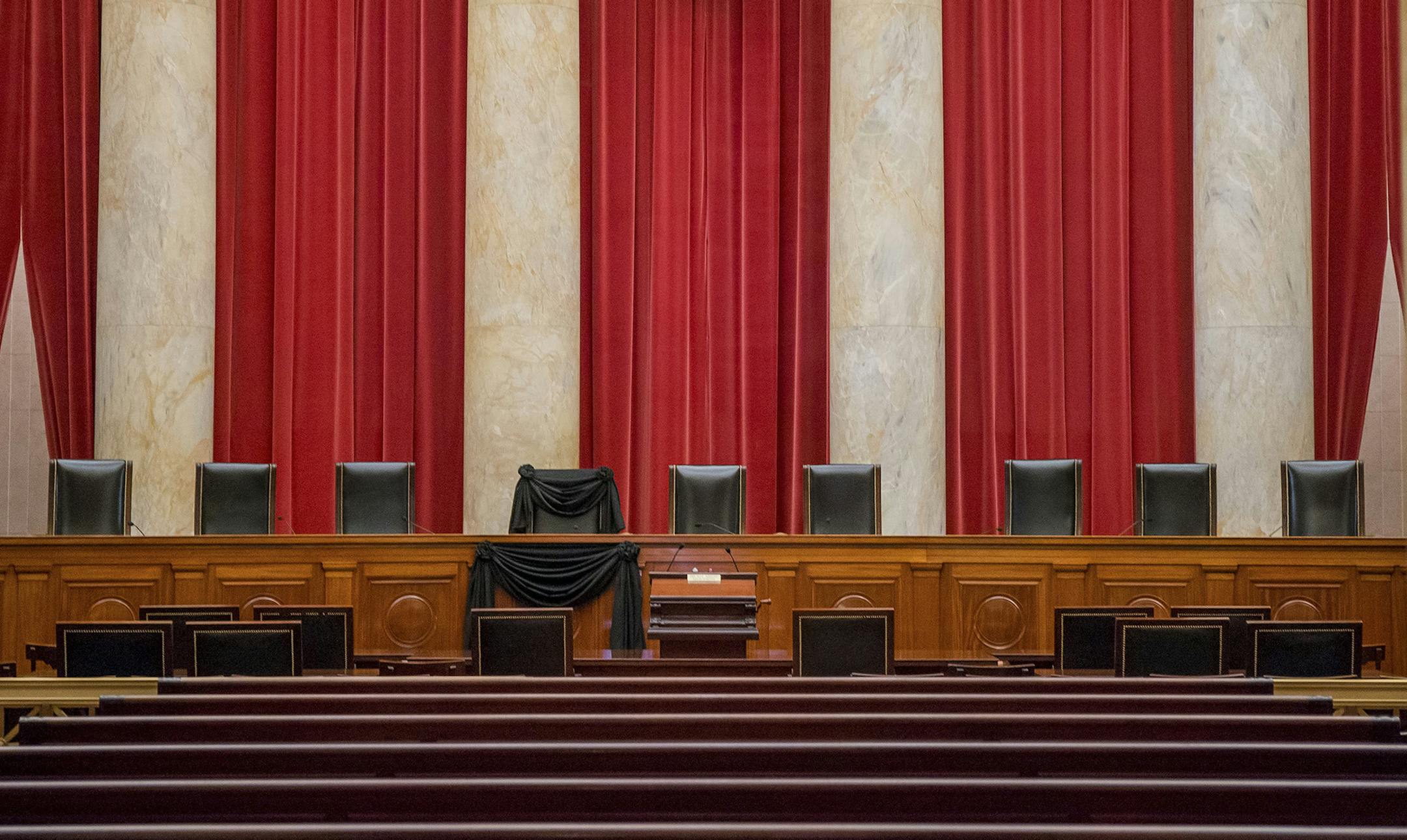 Black bunting hangs over the seat of Justice Antonin Scalia, who died Saturday, in the courtroom of the Supreme Court in Washington, Feb. 16, 2016. Senator Chuck Grassley (R-Iowa) said Tuesday that he had not ruled out holding hearings on President Obamaís eventual nominee to replace Scalia. (Zach Gibson/The New York Times) ORG XMIT: MIN2016021913261263